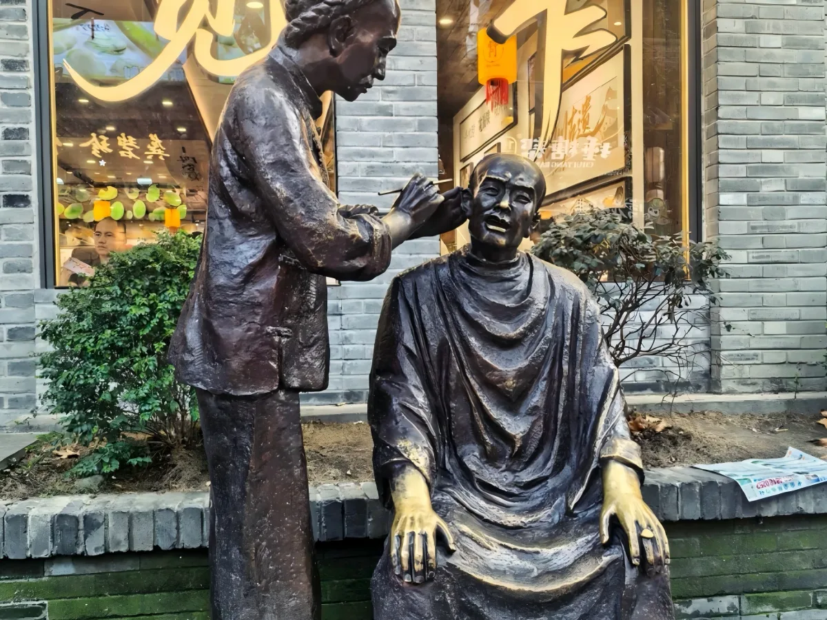 Guided walk through Wide Alley, Narrow Alley & Well Alley. Visit old-Chengdu life exhibition, creative shops and folk-culture relief wall. 30-min free time for tea-tasting, sugar-art watching and independent exploring (personal costs apply). - Photo 2