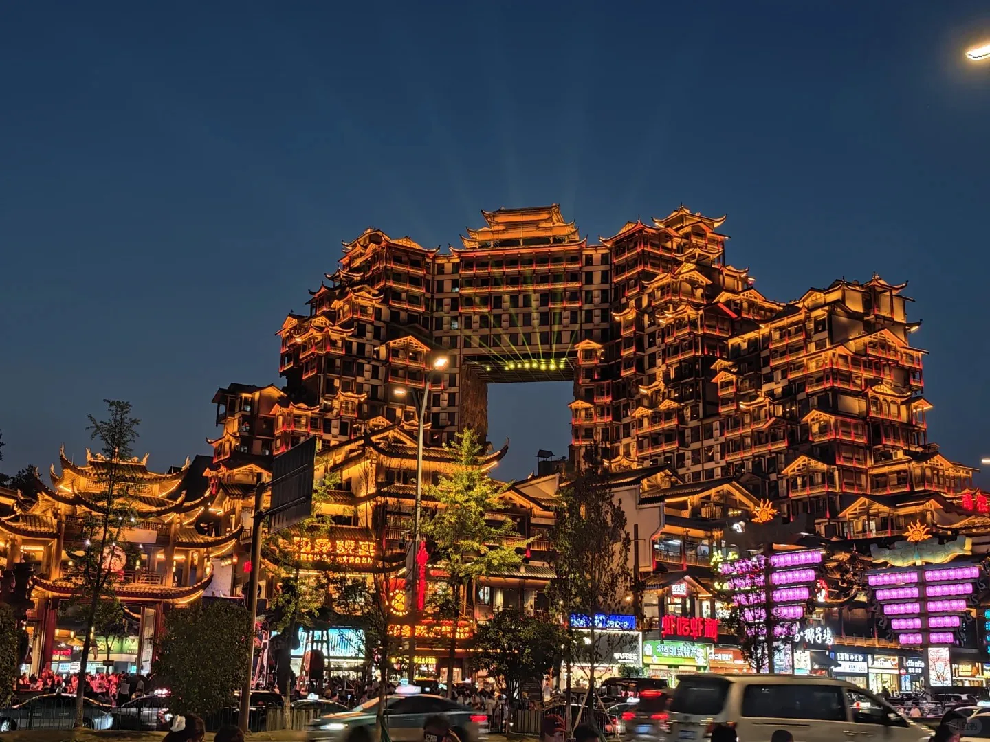 Guided 72 Qilou visit. Discover its Tujia-style stilted architecture, watch scheduled folk performances and visit recommended light-show photo spots.